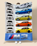 Blanket with BMW M3 car designs held by a person against a beige background