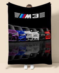 Blanket with BMW M3 logo and colorful cars on a black background