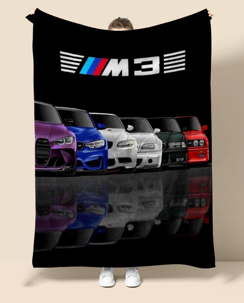 Blanket with BMW M3 logo and colorful cars on a black background
