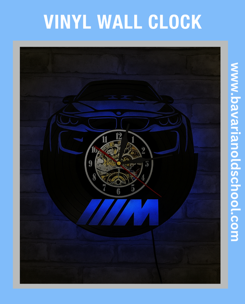 Vinyl wall clock with BMW logo and car design on a blue LED background. Bavarian old school