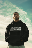 Man wearing a black hoodie with 'Old School' text against a scenic background