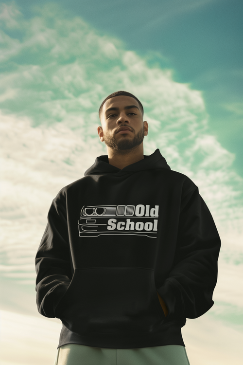 Man wearing a black hoodie with 'Old School' text against a scenic background