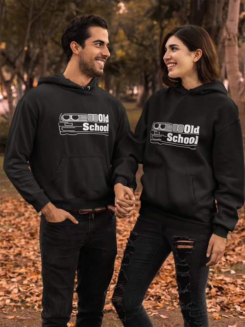 Two people wearing black hoodies with 'Old School' design in a park setting.