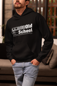 Person wearing a black hoodie with 'Old School' design in a casual setting