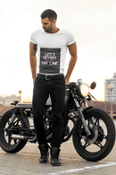 Man standing next to a motorcycle wearing a white t-shirt with text Life`s better in the fast lane. Bavarian old school